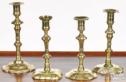 Four English Queen Anne brass candlesticks