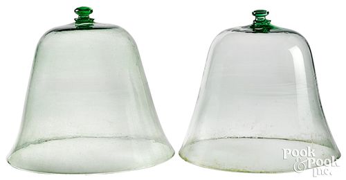 Two pale green aqua glass bell jars