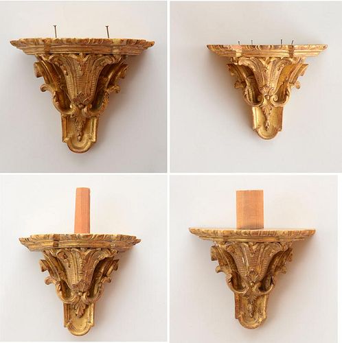 SET OF FOUR RÉGENCE STYLE CARVED GILTWOOD WALL BRACKETS