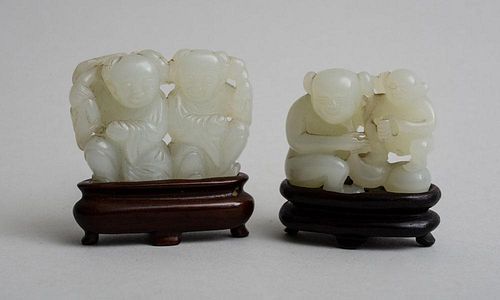TWO CHINESE CARVED PALE GREEN JADE FIGURAL GROUPS