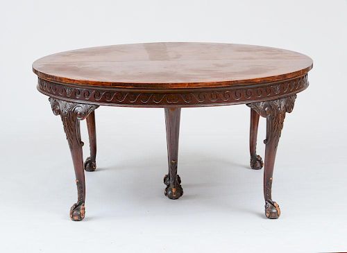 GEORGE III STYLE CARVED MAHOGANY EXTENSION DINING TABLE