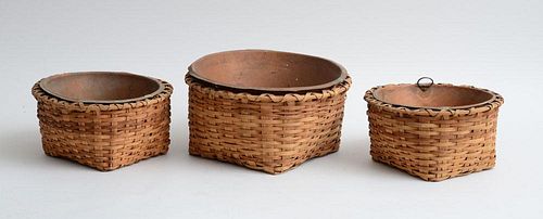 GROUP OF THREE WOVEN LOW BASKETS