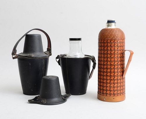 TWO STITCHED LEATHER BOTTLE HOLDERS AND A WICKER-BOUND MERCURY GLASS CARAFE
