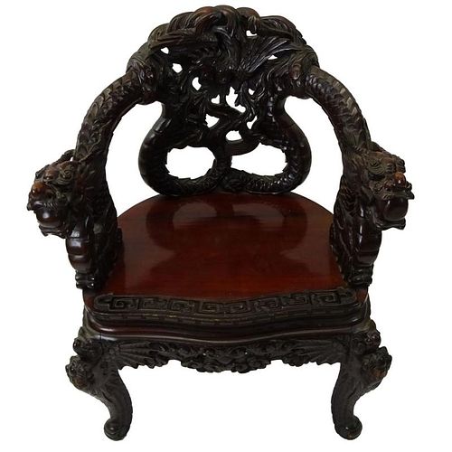 20th Century Chinese Carved Hardwood Dragon Chair.
