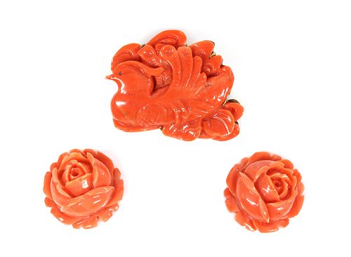 An Asian carved coral plaque brooch,