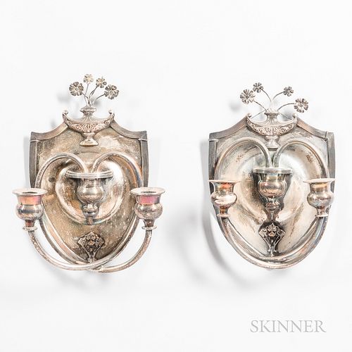 Pair of Silver-plated Two-light Wall Sconces, in the shape of a shield with bouquet detail in a lamp at top and lion motif at bottom, h