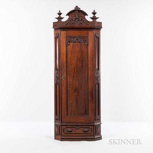 Renaissance Revival Walnut Corner Armoire, 19th century, arched crest with carved foliate detail, single door with floral and foliate c