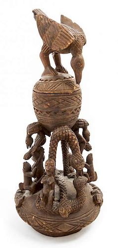 * An African Carved Vessel Height 36 3/4 inches.