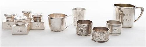 * A Collection of Ten Silver Table Articles, , comprising three napkin rings, four casters and three small mugs, each with vario