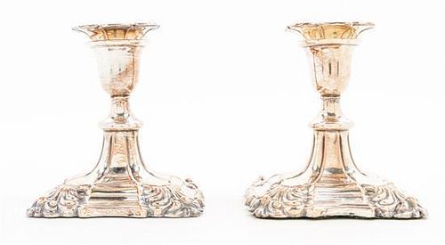 A Pair of Silver-plate Candlesticks Height 4 1/2 inches.