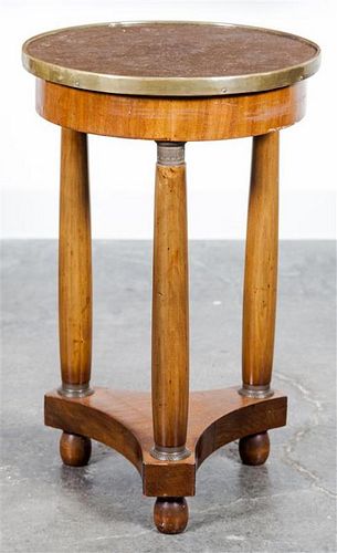 A Biedermeier Fruitwood Veneered Occasional Table Height 25 x diameter 16 inches.