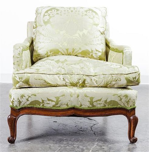 * A Louis XVI Style Walnut Bergere Height 34 inches.