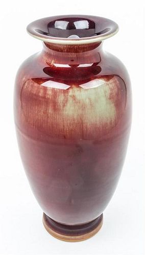 A Porcelain Sang de Boeuf Vase Height 13 3/4 inches.