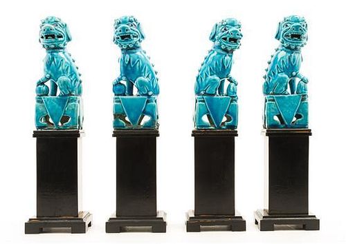 * Four Chinese Turquoise Glazed Porcelain Figures of Fu Lions. Height of each 6 inches.