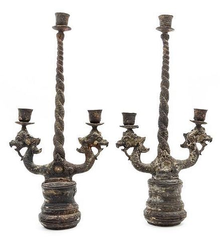 A Pair of Tibetan Cast Metal Three-Light Candelabra Height 15 1/2 inches.