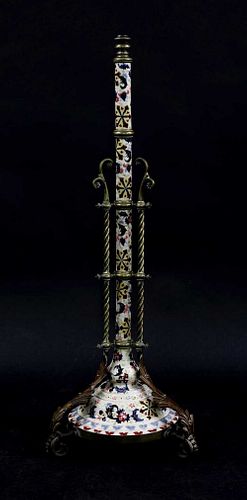 A Hungarian porcelain and brass adjustable standard lamp,