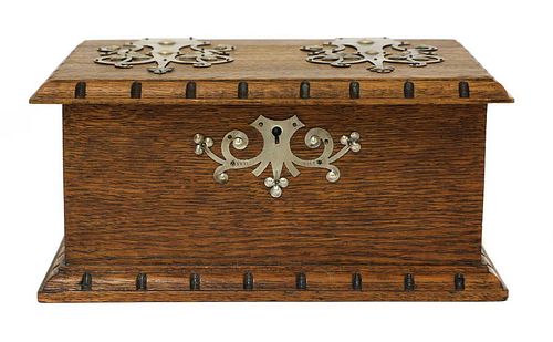 An Arts and Crafts oak and pewter-mounted casket,