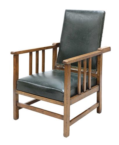 An Arts and Crafts oak reclining armchair,