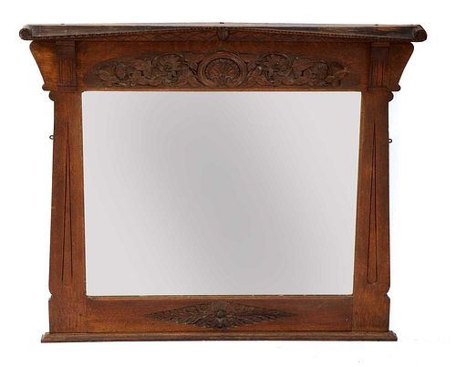An Arts and Crafts Hampshire School oak overmantel,