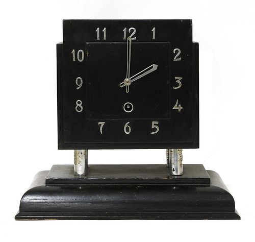 An Art Deco ebonised mantel clock,
