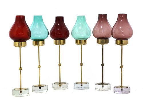 A set of six brass and glass candlesticks,