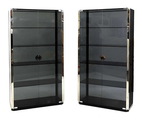 A pair of smoked glass and chrome display cabinets,