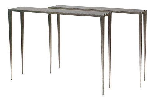 A pair of contemporary moulded aluminium console tables,