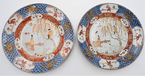 Pair of Chinese Export Porcelain Dishes or Chargers
painted courtyard center decoration of man scaling garden wall to meet woman, blue cross hatching 