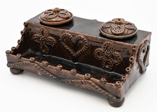 Earthenware Double Inkwell
having molded heart and flower decoration
height 3 1/2 inches, length 8 inches
