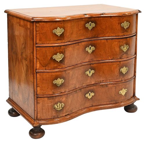 Queen Anne Walnut Serpentine Front Chest
having four drawers set on suppressed ball feet
probably Germany
18th century
height 30 1/2 inches, case widt