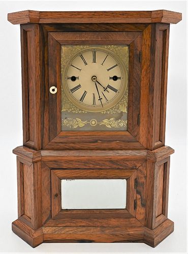Atkins Rosewood Wagon Spring Clock
having 30 day "Equalizing Lever Spring" movement and pendulum, replaced dial
height 17 1/2 inches
Provenance: Fifty