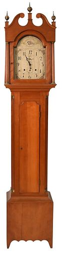 Federal Cherry Tall Clock with Tombstone Dial
having painted wooden dial and wood works
case having fluted columns
height 90 inches
Provenance: Fifty 