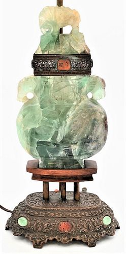 Chinese Green Quartz Urn
having carved animals, made into a table lamp on bronze base mounted with stones
overall height 29 inches
Provenance: Waterfr
