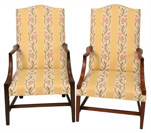 Two Near Matching Federal Lolling Chairs
having matching upholstery
one with legs ended out
circa 1800
height 43 1/2 inches and 44 inches