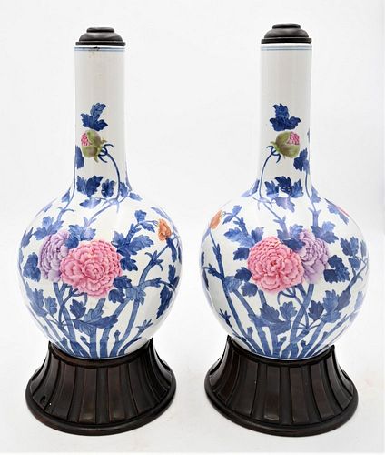 Pair of Chinese Famille Rose Porcelain Vases 
having painted blossoming flowers with blue vine and leaves
bearing blue seal mark on bottom, on wood ba