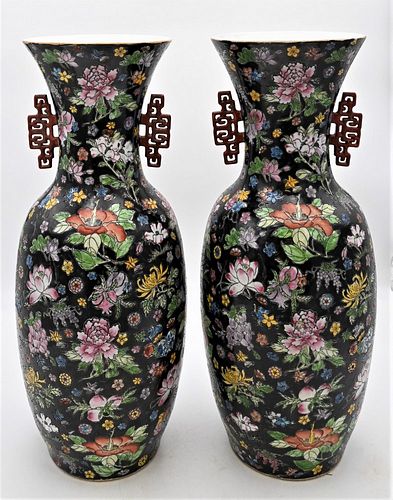 Pair of Chinese Famille Rose Vase
having red handles
marked to the underside
height 23 1/4 inches