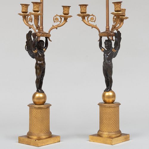 Pair of Empire Style Gilt and Patinated Bronze Three-Light Figural Candelabra