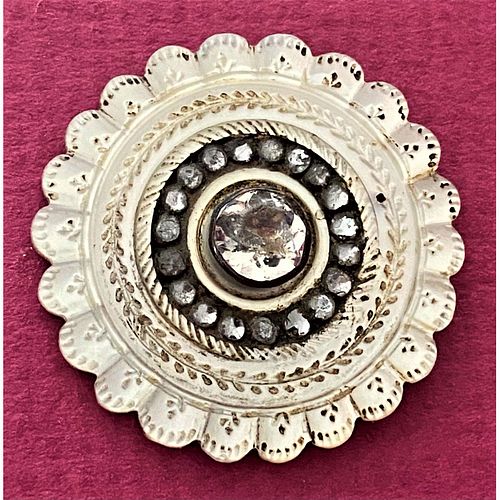 AN 18TH CENTURY CARVED PEARL BUTTON
