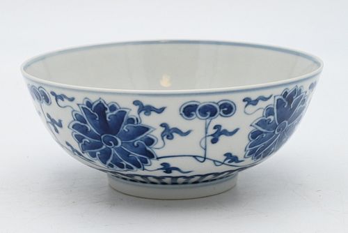 Chinese Blue and White Porcelain Flower Bowl
having painted blue lotus flowers
six character marks and wax seal on bottom
height 2 1/2 inches, diamete