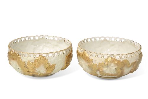 A PAIR OF ROYAL WORCESTER LEAF-MOULDED BOWLS, shape no.1004, with pierced r