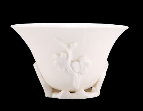 A CHINESE BLANC DE CHINE LIBATION CUP, PROBABLY KANGXI PERIOD, moulded with
