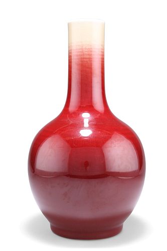 A CHINESE SANG-DE-BOEUF VASE, bottle-shaped, drilled. 33cm high