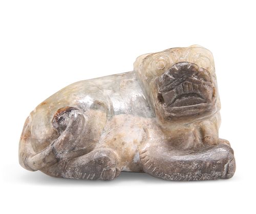 A CHINESE JADE DOG, carved recumbent. 6cm