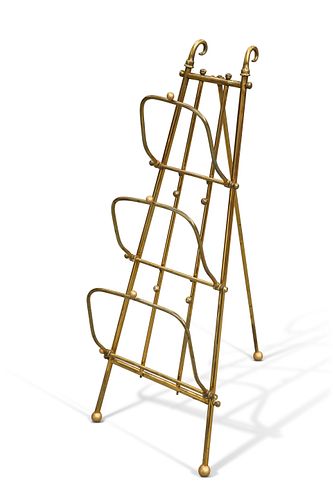 AN EDWARDIAN BRASS THREE DIVISION COLLAPSIBLE NEWSPAPER RACK, of tapering e