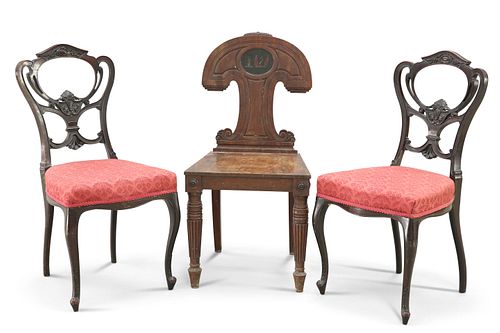 A REGENCY MAHOGANY HALL CHAIR, the unusually shaped back with painted crest