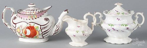 Queen's Rose teapot, 19th c., 5 3/4'' h., together with an ironstone sugar and creamer.