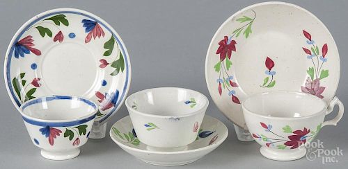 Three miniature pearlware cups and saucers, 19th c.