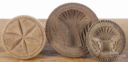 Three turned and carved butter prints, 19th c., largest - 4 1/2'' dia.