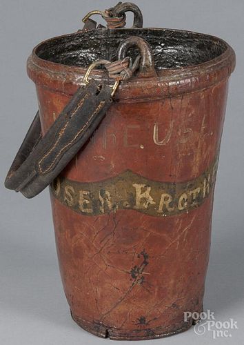 Painted leather fire bucket, 19th c., with later decoration, 13'' h.