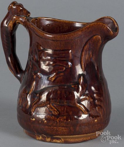 Rockingham glaze hound handled pitcher, 19th c., 8'' h. Provenance: The Estate of Bernard B. Hillmann